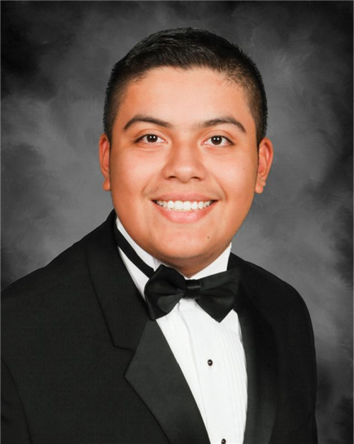 A teenage boy in a tuxedo